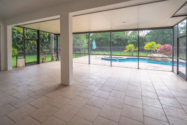 unfurnished sunroom featuring a pool