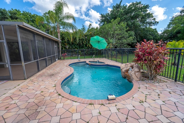 view of pool with an in ground hot tub and a patio area