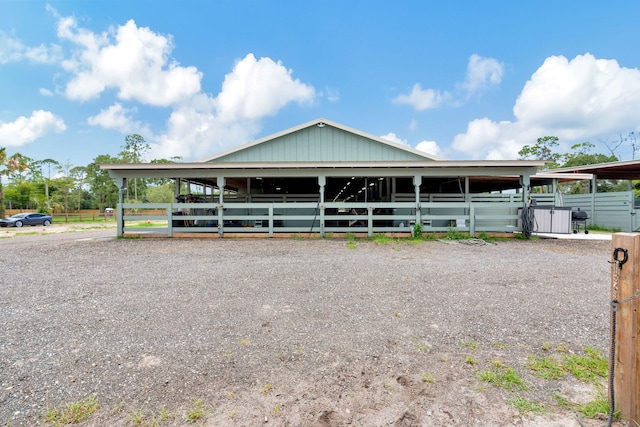 farmhouse featuring an outbuilding