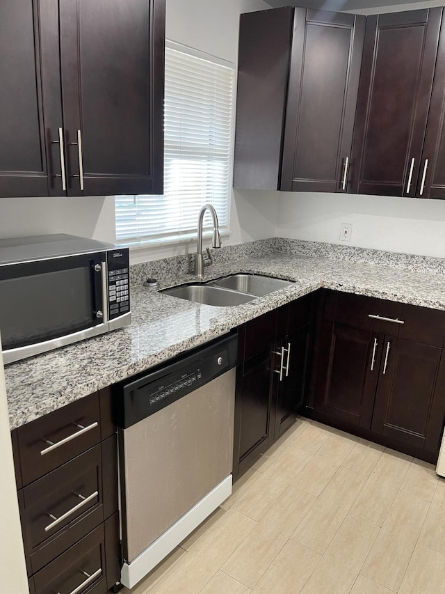 244 Lake Dora Dr, West Palm Beach, FL 33411 - kitchen featuring dark brown cabinets, stainless steel appliances, and sink