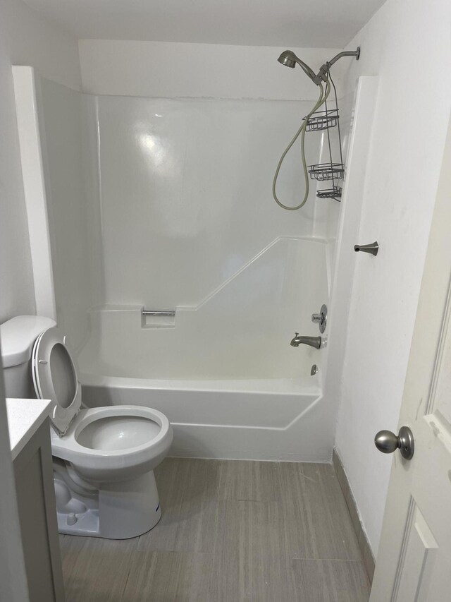 full bathroom featuring vanity, toilet, and shower / bathtub combination