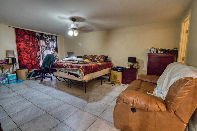 tiled bedroom with ceiling fan