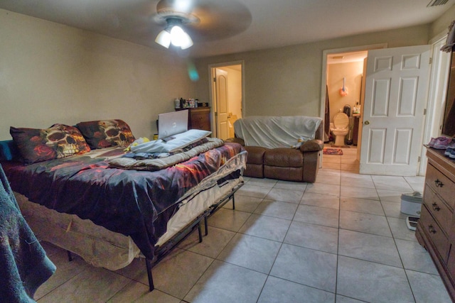 bedroom with ceiling fan and light tile patterned floors