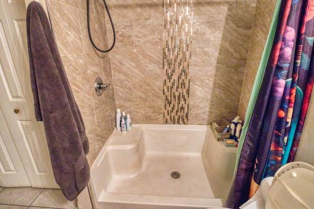 bathroom with tile patterned flooring and curtained shower