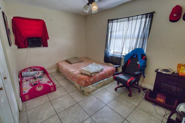 bedroom featuring ceiling fan and light tile patterned flooring