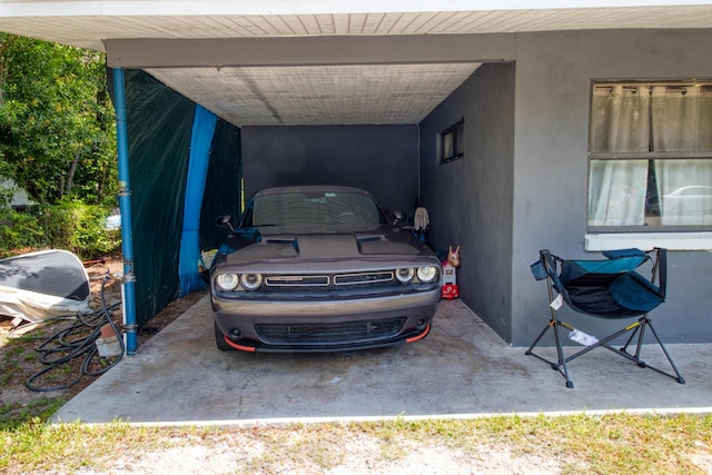 view of vehicle parking with a carport