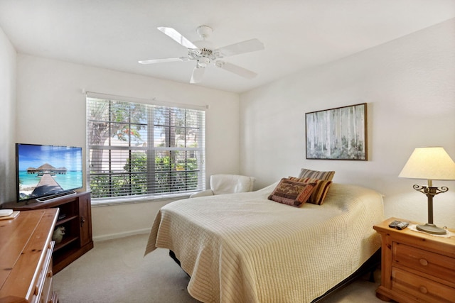 bedroom featuring ceiling fan and light colored carpet