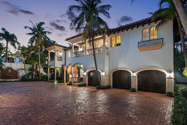 mediterranean / spanish-style home with a balcony