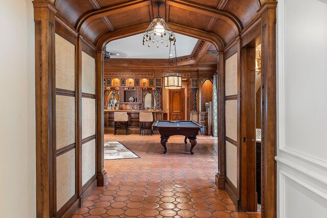 interior space with tile patterned floors, billiards, and vaulted ceiling