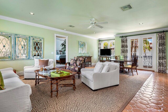 living room with crown molding, french doors, and ceiling fan