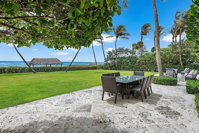 view of patio with a water view