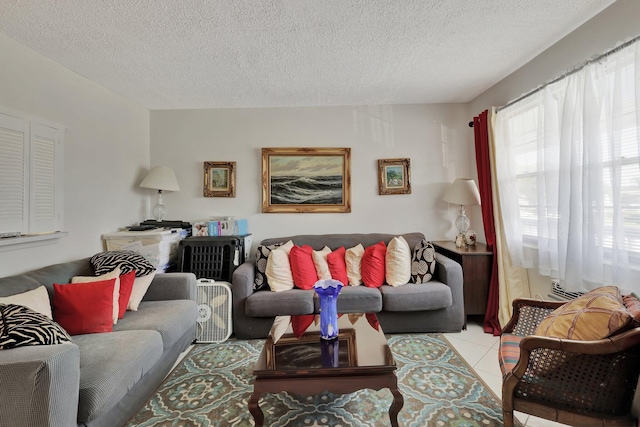 living room featuring tile flooring and a textured ceiling