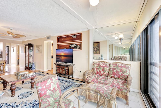 tiled living room featuring a textured ceiling, plenty of natural light, ceiling fan, and crown molding