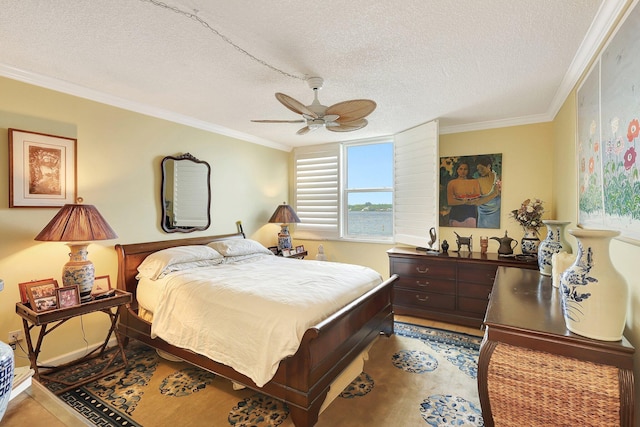 bedroom with ceiling fan, a textured ceiling, and ornamental molding