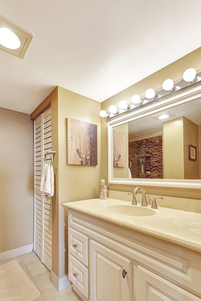 bathroom with tile patterned floors and vanity