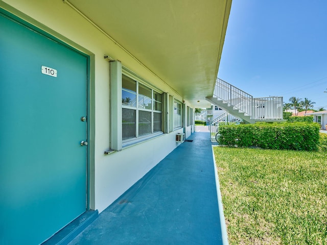 entrance to property with a yard