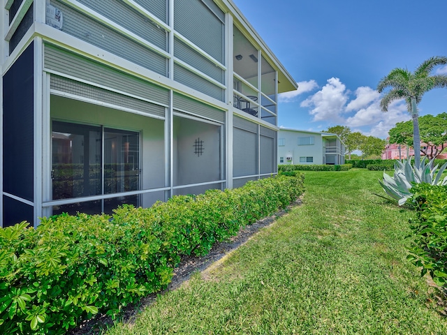 view of property exterior featuring a lawn