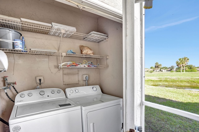 clothes washing area featuring washing machine and clothes dryer