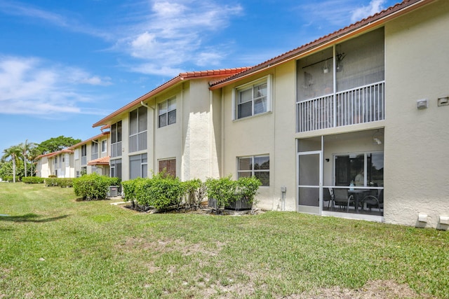 view of property featuring central AC unit