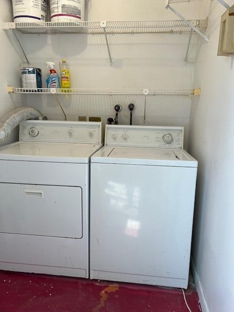 laundry room with washing machine and clothes dryer