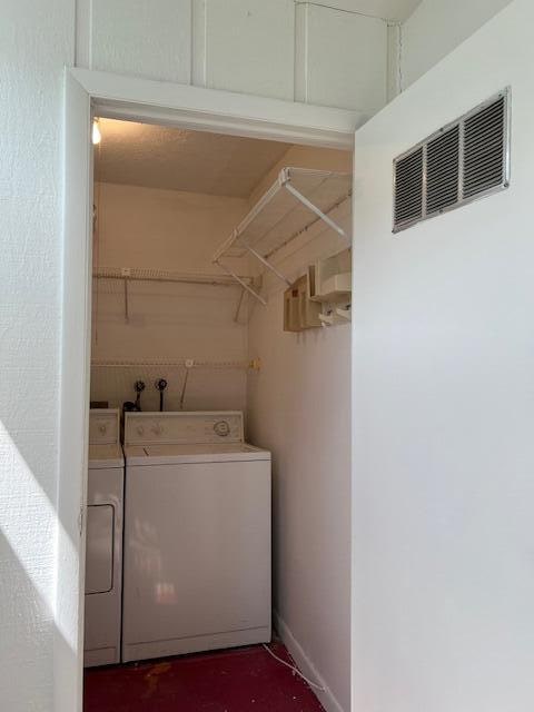 washroom with washer and clothes dryer