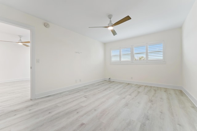 spare room featuring ceiling fan and light hardwood / wood-style floors