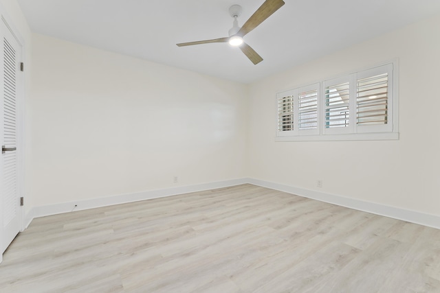 empty room featuring light wood-type flooring and ceiling fan