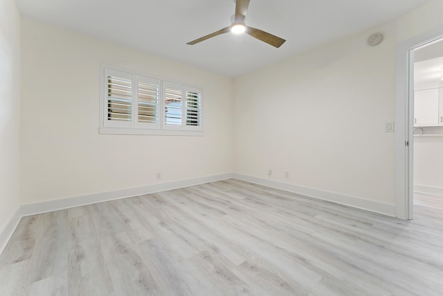 spare room with light hardwood / wood-style floors and ceiling fan