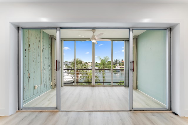 entryway with light hardwood / wood-style floors and ceiling fan