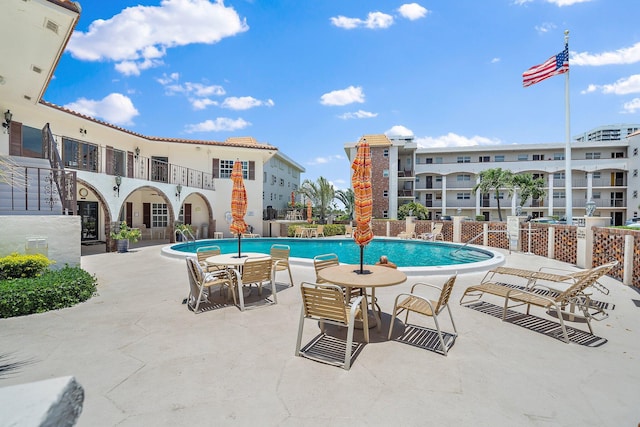 view of swimming pool with a patio