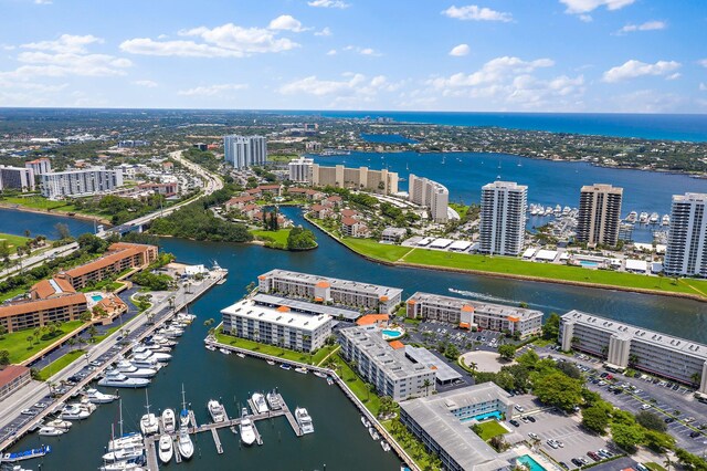 birds eye view of property with a water view