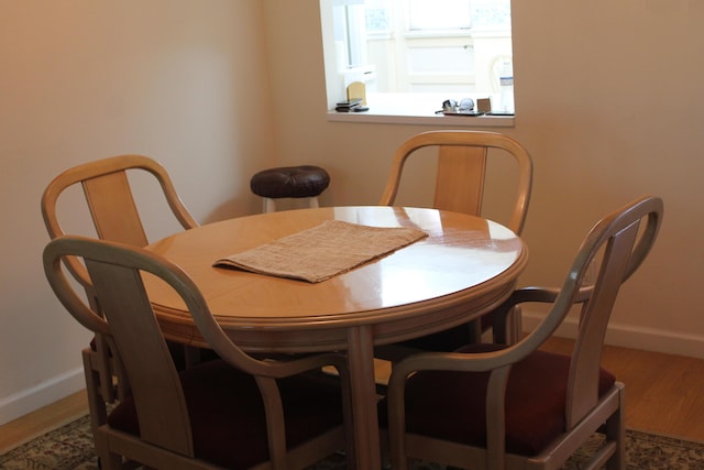 dining space featuring hardwood / wood-style flooring