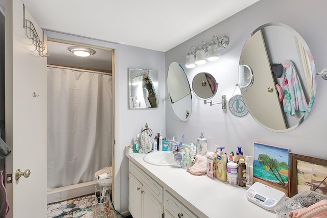 bathroom with tile flooring and vanity