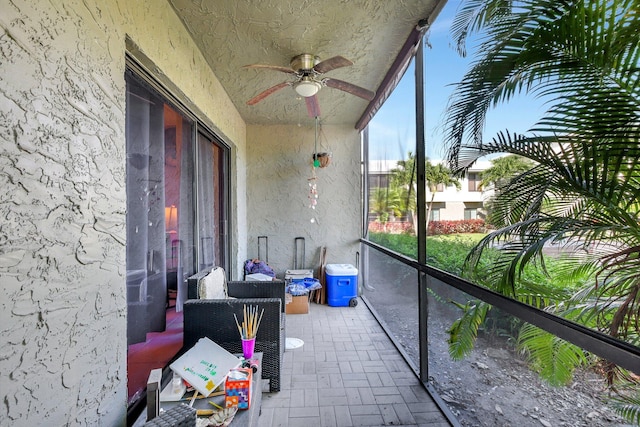 exterior space featuring ceiling fan