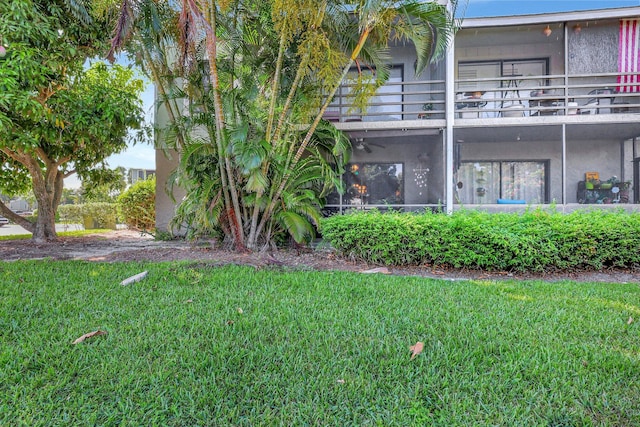 view of yard featuring a balcony