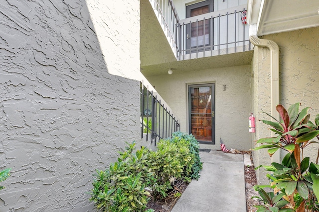 entrance to property with a balcony