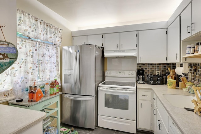 kitchen featuring stainless steel fridge with ice dispenser, backsplash, tile flooring, white range with electric cooktop, and sink