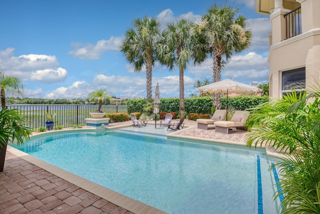 view of swimming pool with a patio area