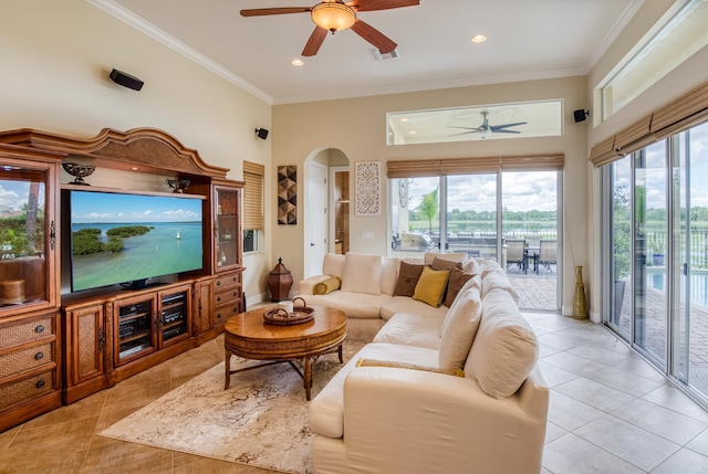 tiled living room with crown molding and ceiling fan