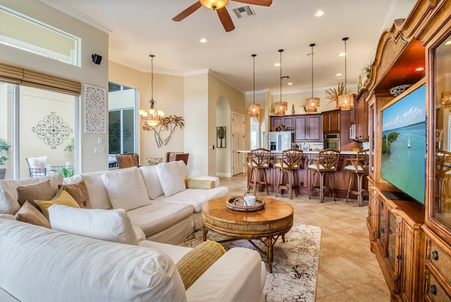 tiled living room with crown molding and ceiling fan with notable chandelier