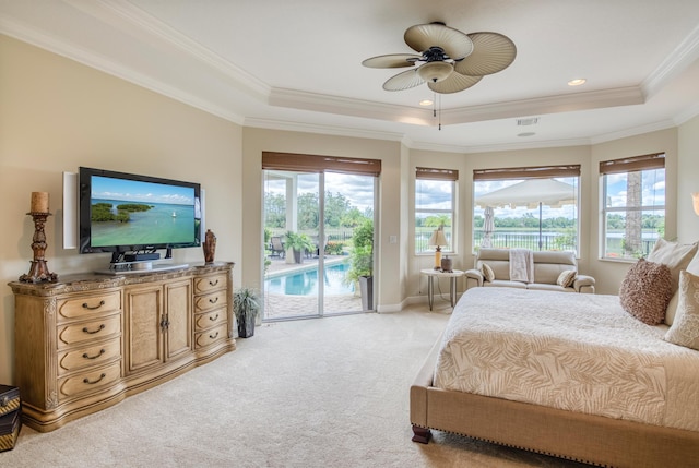 bedroom featuring ceiling fan, a raised ceiling, light carpet, and access to outside