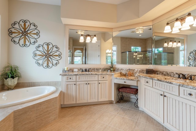 bathroom featuring tile patterned floors, vanity, and separate shower and tub