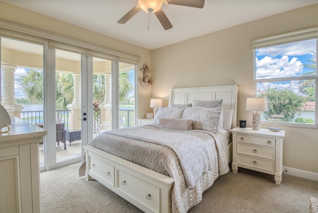 carpeted bedroom with access to outside and ceiling fan