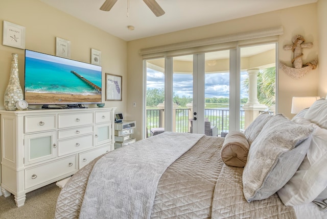 bedroom with ceiling fan, access to exterior, and light carpet