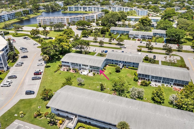 birds eye view of property featuring a water view