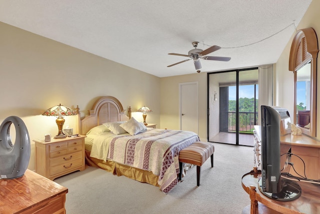 bedroom with light carpet, a textured ceiling, access to exterior, and ceiling fan