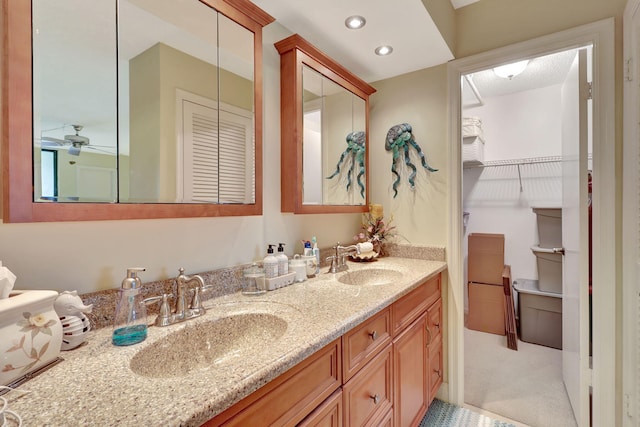 bathroom with vanity and ceiling fan