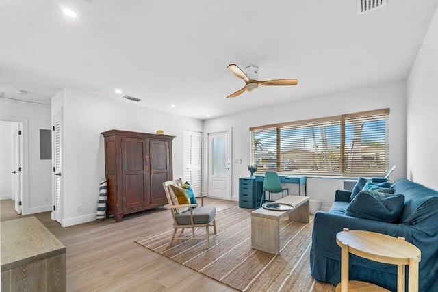 sitting room featuring ceiling fan and light wood-type flooring