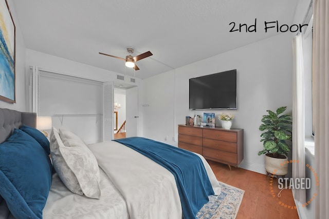 bedroom featuring hardwood / wood-style flooring and ceiling fan