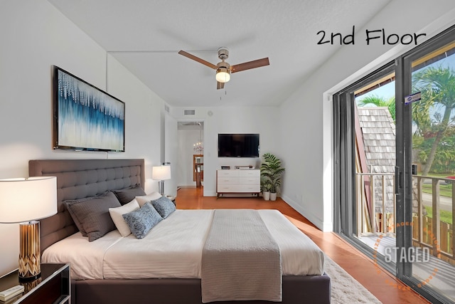 bedroom featuring access to outside, light hardwood / wood-style flooring, and ceiling fan